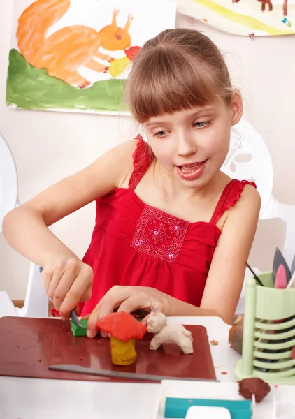 Child playing with plasticine in school. — Stock Photo, Image