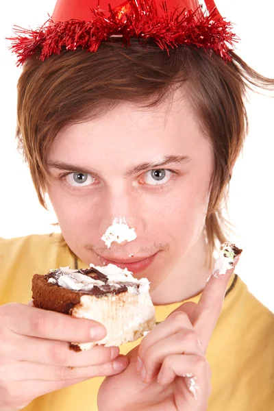 Young man eating chocolate cake. — Stock Photo, Image