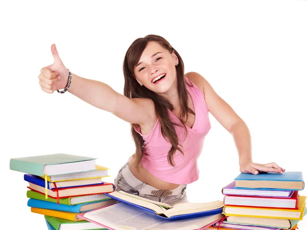 Mädchen mit gestapeltem Buch zeigt Daumen nach oben. — Stockfoto