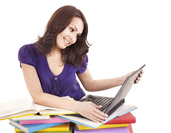 Chica con apilar libro de color y portátil . — Foto de Stock