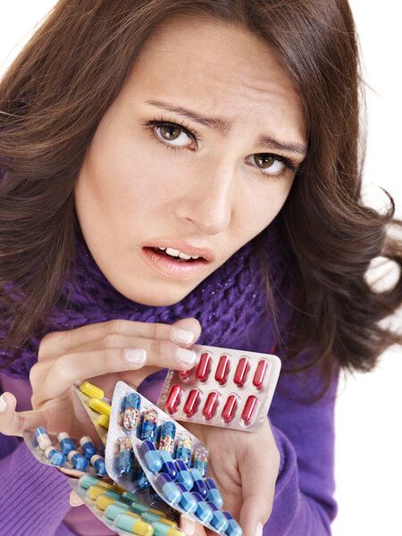 Girl having flu taking pills