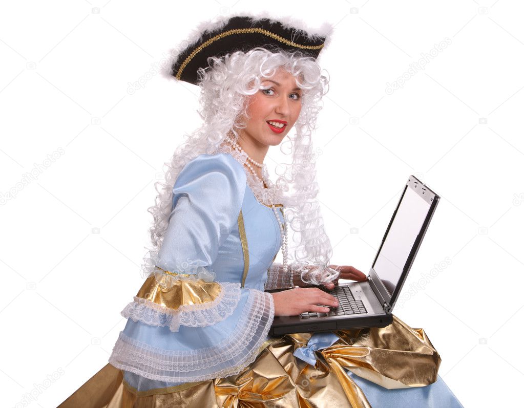 Woman in ancient dress with laptop.