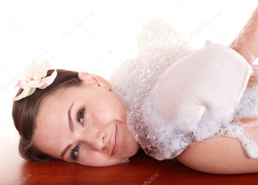 Young woman having massage in hamam.