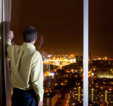 Man looking over city clipart