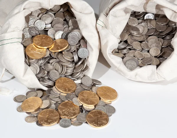 Bag of silver and gold coins Stock Image