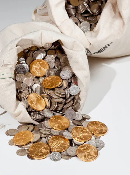 Bag of silver and gold coins Royalty Free Stock Photos