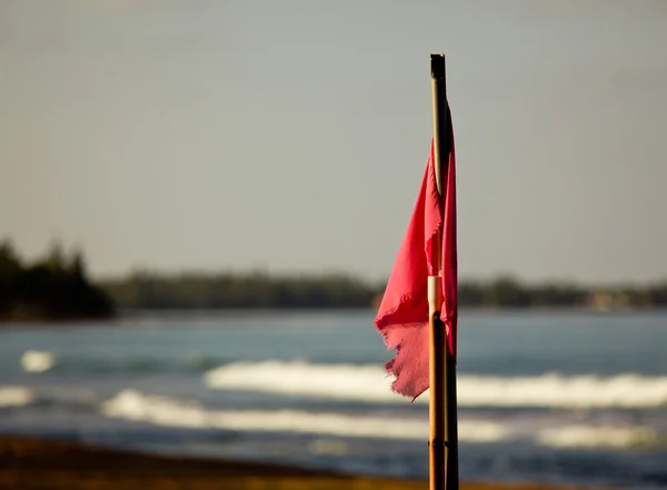 Red flag at sunset — Stock Photo, Image