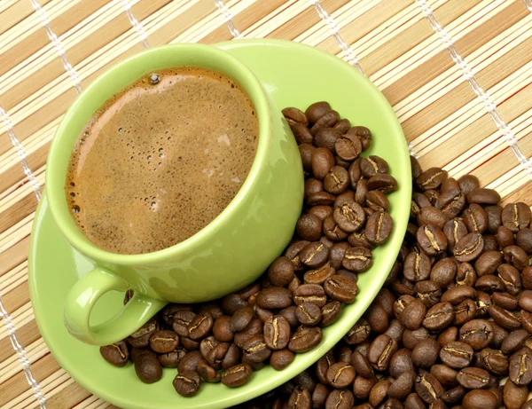 Koffiekopje op de mat — Stockfoto