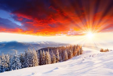 Majestic sunset in the winter mountains landscape. HDR image clipart