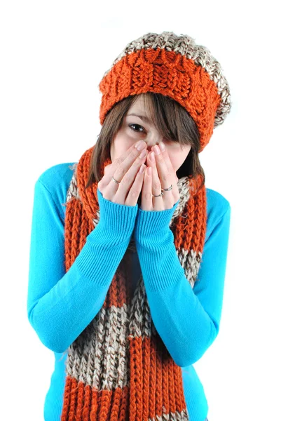 stock image Sneezing woman, wearing a hat and scarf, isolated on white