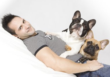 A young handsome man with a small french bulldog clipart