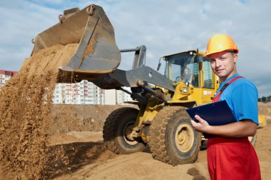 Happy builder inspector at construction area clipart