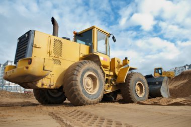 Wheel loader at work clipart