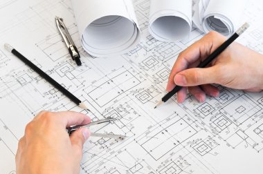 Design drawings and human hands clipart