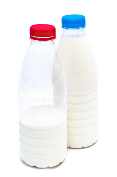 stock image Two white plastic bottles with milk