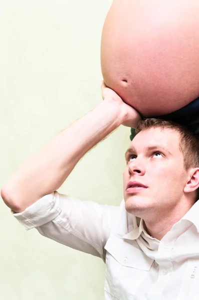 Pregnant woman with her husband holding belly his hands. Caucasians, a lovi — Stock Photo, Image