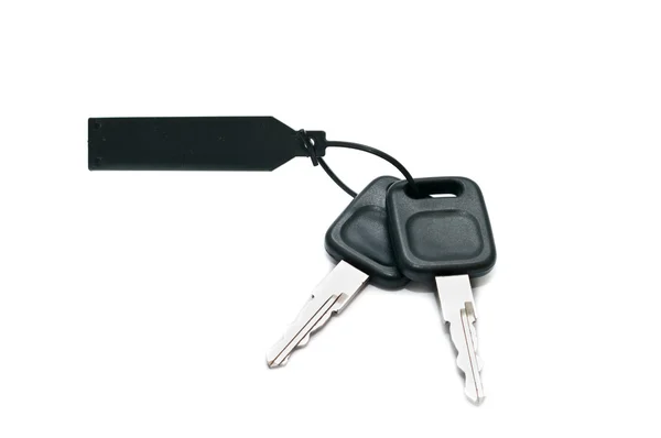Куча ключей от машины на белом фоне — стоковое фото