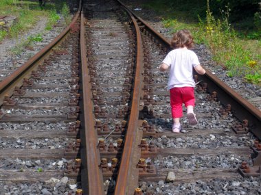 Girl at Railroad tracks clipart