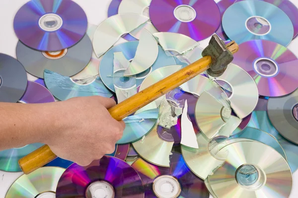 Hand beating out cd — Stock Photo, Image