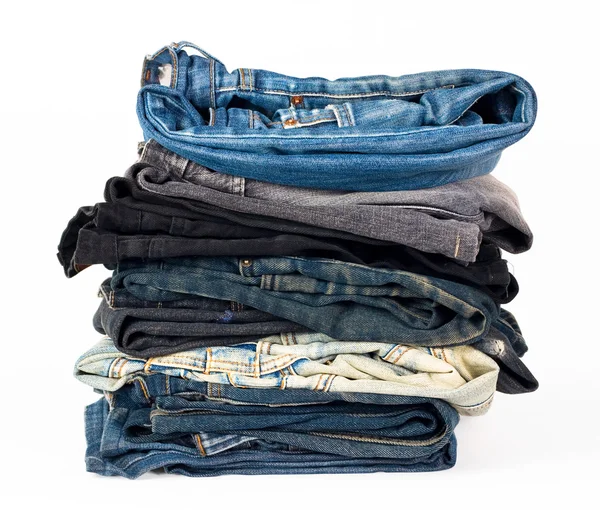 Stack of various jeans isolated on white — Stock Photo, Image