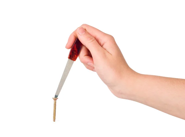 The woman twists a screw a nail file — Stock Photo, Image