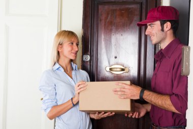 Delivery Boy with Box for Young Woman clipart