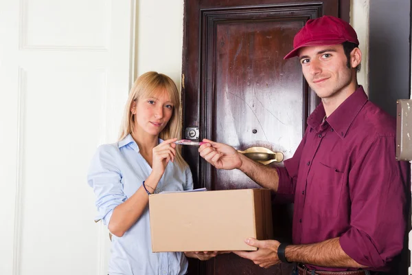 Delivery Boy with Box for Young Woman — Stock Photo, Image