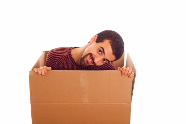 Mladý muž uvnitř krabice — Stock fotografie