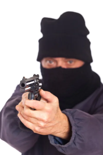 Ladrão apontando uma arma a um assalto — Fotografia de Stock