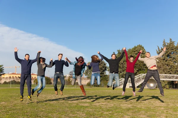 Group Happy College Students Jumping Park — Stock Photo, Image