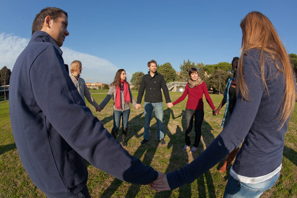 Multiracial Young Holding Hands in a Circle