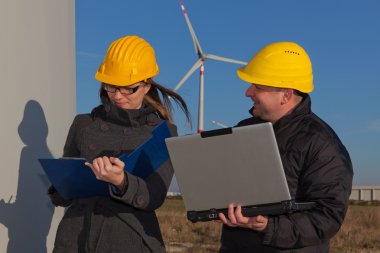 Two Engineers in Wind Turbine Power Generator Station clipart