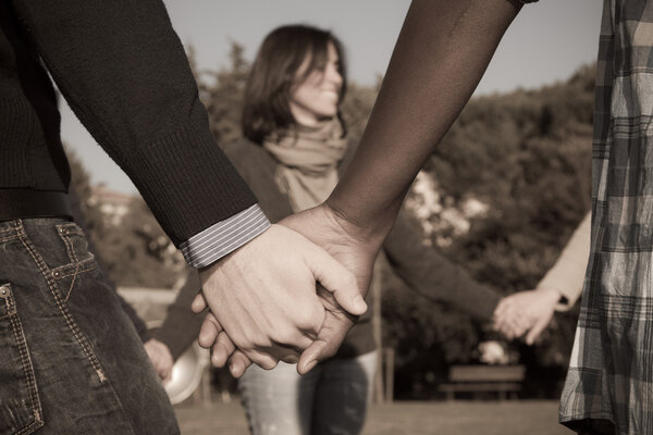 Multiracial Young Holding Hands in a Circle