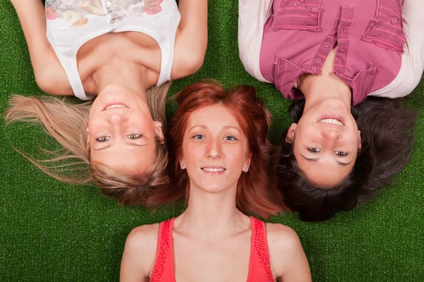 Young Girls Lying on the Ground Stock Photo