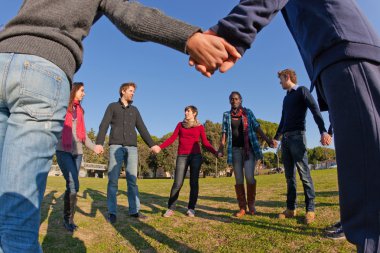 Multiracial Young Holding Hands in a Circle clipart