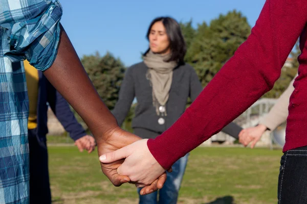 Multiracial Young Holding Hands in a Circle — Stock Photo, Image