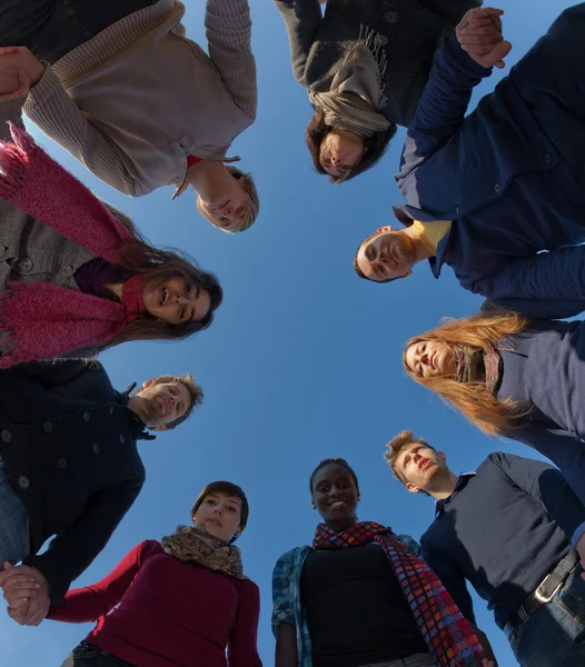 Multiracial Holding Hands in a Circle, Low Angle View — Stock Photo, Image
