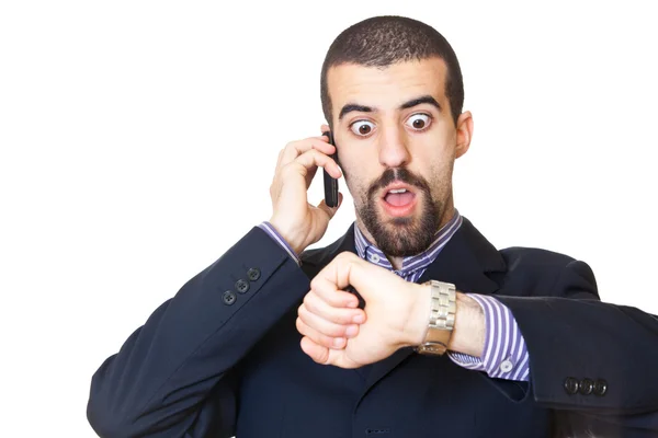Drukke zakenman praten op mobiele telefoon tijdens het kijken naar tijd — Stockfoto