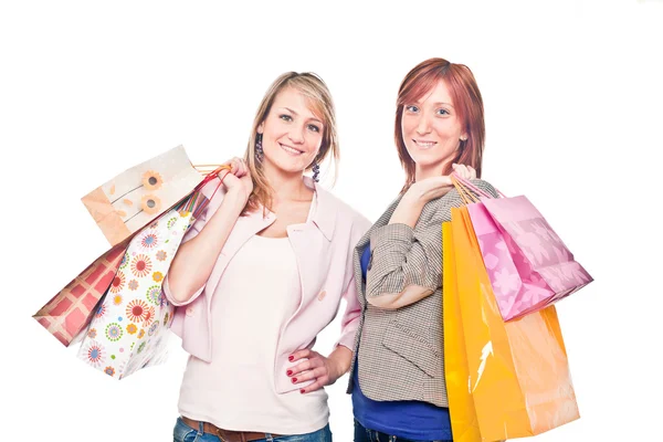 Twee meisjes met shopping tassen — Stockfoto