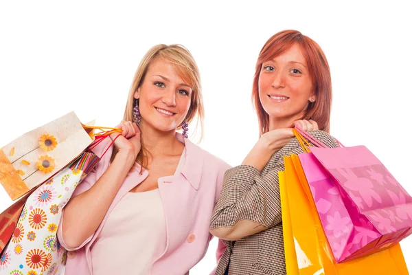 Twee meisjes met shopping tassen — Stockfoto
