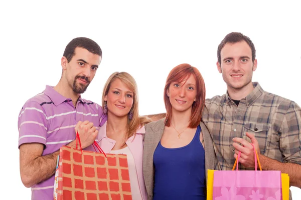 Jovens com sacos de compras — Fotografia de Stock
