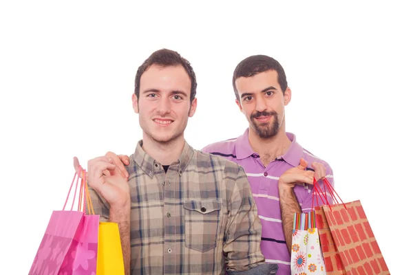 Jovem casal homossexual com sacos de compras — Fotografia de Stock