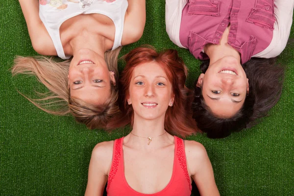 Young Girls Lying on the Ground Stock Image