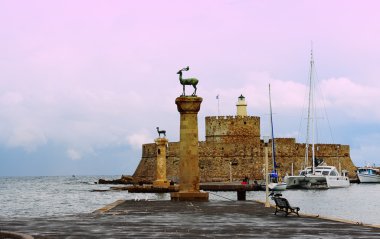 Harbor Gates and Lighthouse St. Nicholas at Rhodes, Greece. clipart