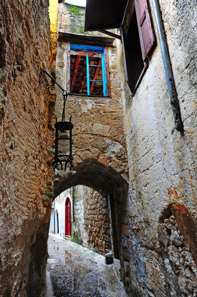 Narrow Alley With Old Buildings on Greece City of Rhodes