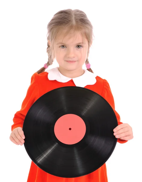 stock image The little girl holds vinyl record on a white background. Looking at camera.