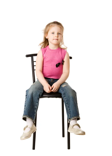 Lány ül a széken — Stock Fotó
