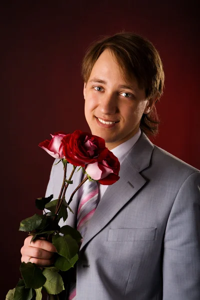 Man with flowers — Stock Photo, Image
