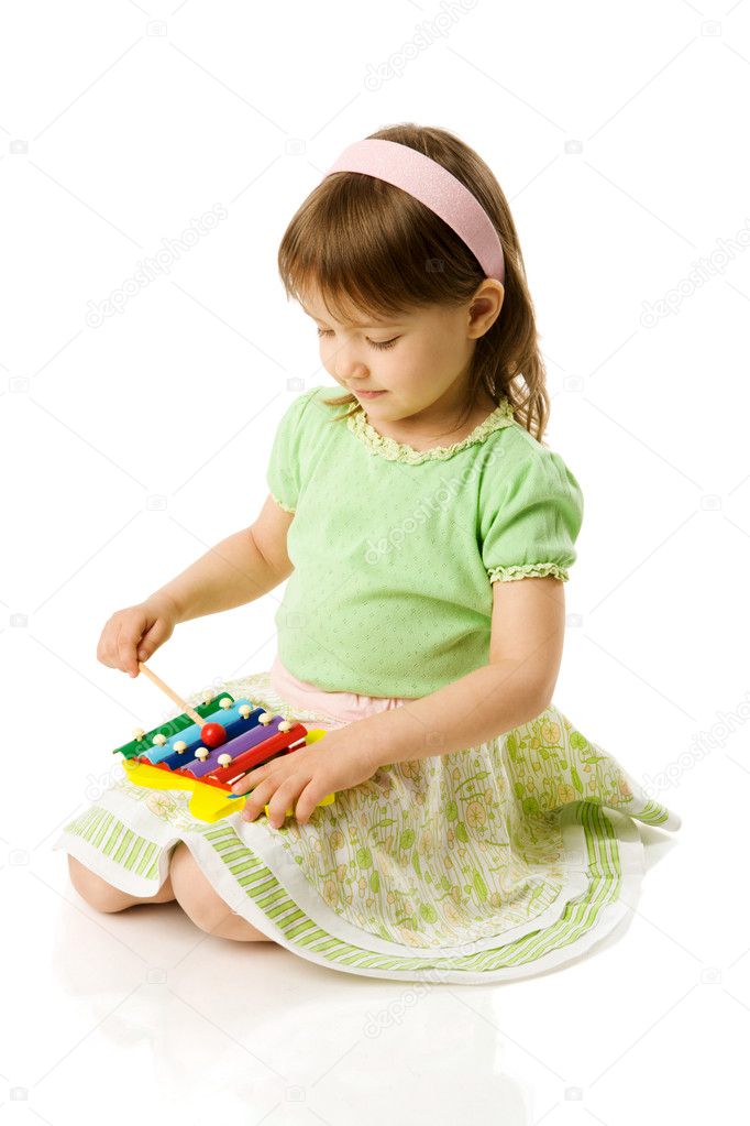 Girl playing on xylophone