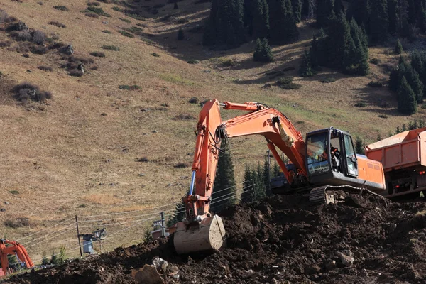 Stock image Excavator is digging soil